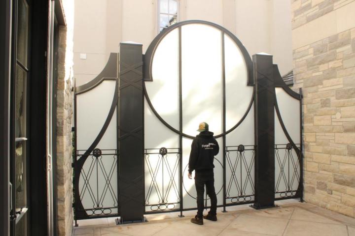 Custom steel gate with circular window detail
