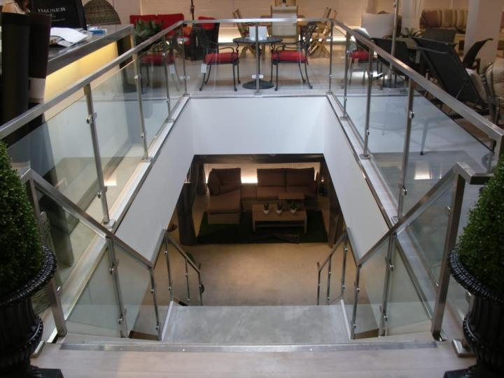 Glass and metal railings around a stairwell